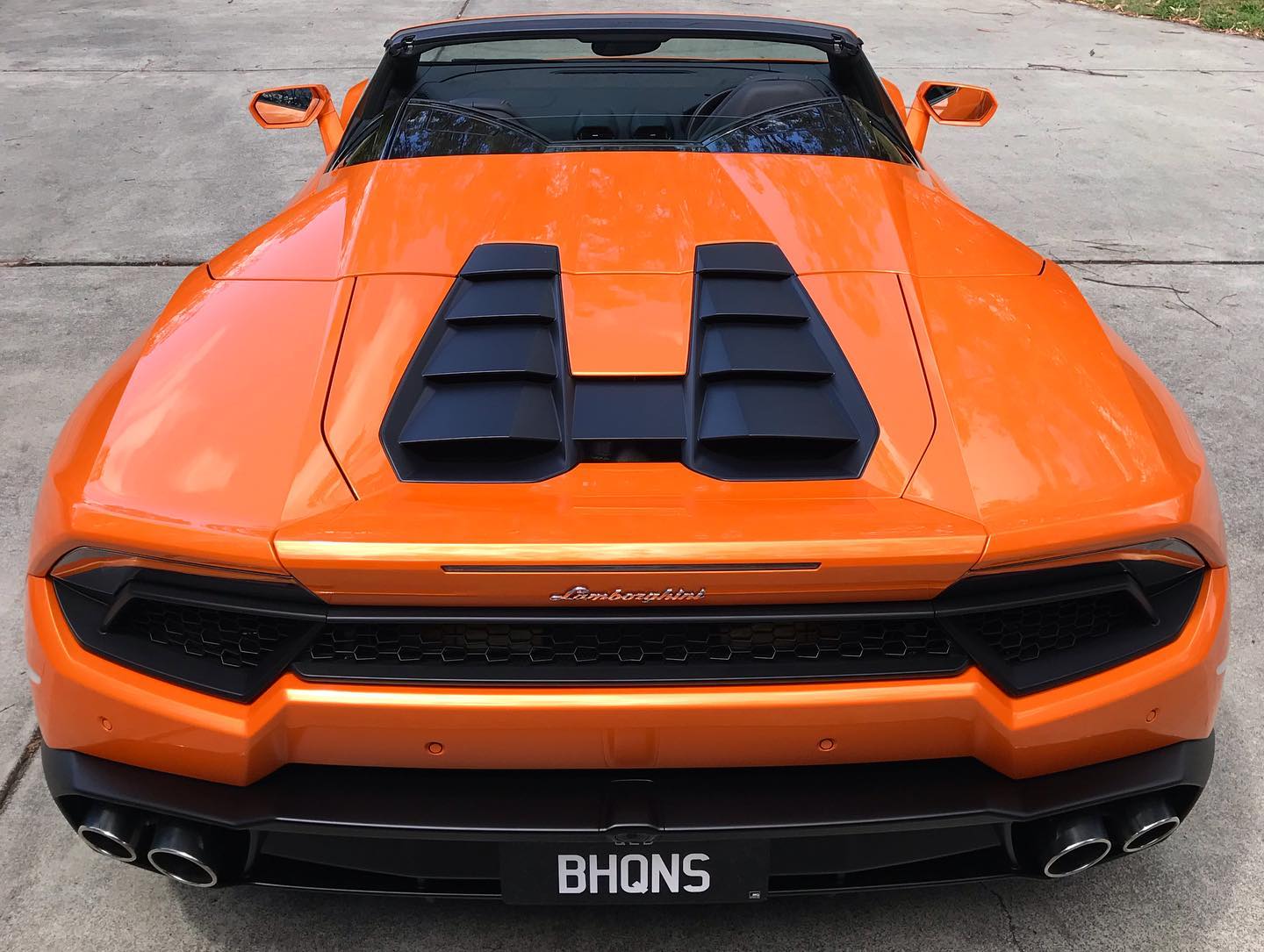 Orange Lamborghini Huracán Spyder rear three-quarter detailed